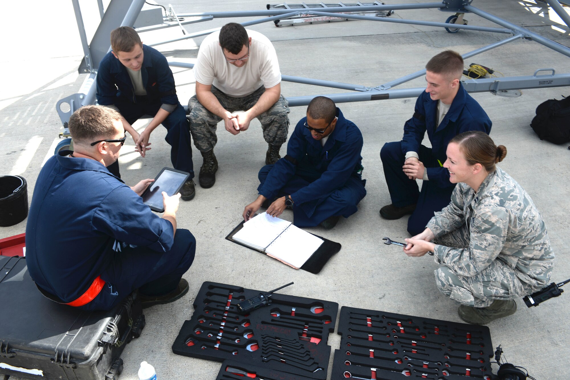 Capt. Lacey Koelling, officer in charge of the 34th Aircraft Maintenance Unit, visits Staff Sgt. Justin Green, electro environmental systems specialists assigned to the 28th Aircraft Maintenance Squadron, on Ellsworth Air Force Base, S.D., Sept. 26, 2017. Koelling likes to spend as much time as she can with Airmen on the flightline and encourage them throughout the day. (U.S. Air Force photo by Airman 1st Class Thomas Karol)