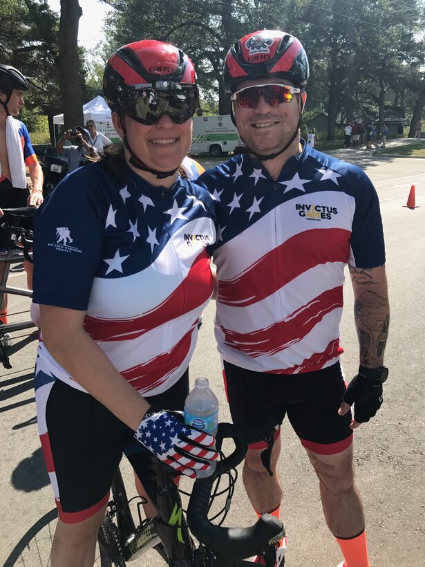 U.S. Air Force veteran Kyle Burnett, a former knowledge operations master sergeant, stands with her teammate and fiancé U.S. Air Force veteran Reese Hines, a former explosive ordnance disposal master sergeant, during the cycling competition of the 2017 Invictus Games in Toronto, Canada, Sept. 26, 2017. The duo met during a softball league sponsored by the Air Force Wounded Warrior (AFW2) program in Alaska in September 2015, and have been inseparable since. (Courtesy photo)