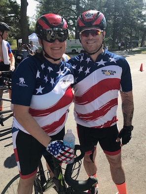 U.S. Air Force veteran Kyle Burnett, a former knowledge operations master sergeant, stands with her teammate and fiancé U.S. Air Force veteran Reese Hines, a former explosive ordnance disposal master sergeant, during the cycling competition of the 2017 Invictus Games in Toronto, Canada, Sept. 26, 2017. The duo met during a softball league sponsored by the Air Force Wounded Warrior (AFW2) program in Alaska in September 2015, and have been inseparable since. (Courtesy photo)
