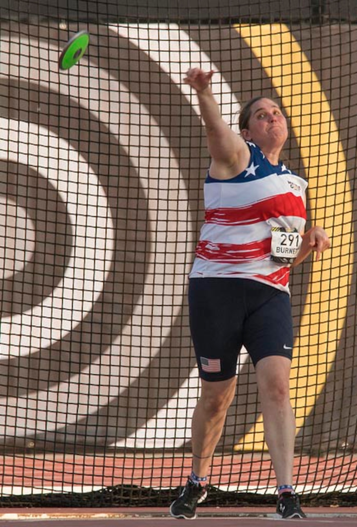 U.S. Air Force veteran Kyle Burnett, a former knowledge operations master sergeant, competes in the discus portion of athletics at the 2017 Invictus Games in Toronto, Canada, Sept. 24, 2017. Burnett sustained a permanent traumatic brain injury and was later diagnosed with posttraumatic stress disorder after a rocket landed roughly 10 feet away from her while stationed in Basra, Iraq in 2009. (Courtesy photo)