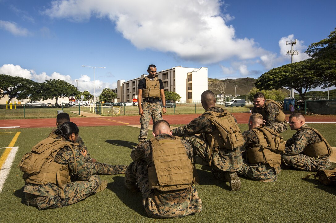 Sgt. Manuel Mejia, a Marine Corps Martial Arts Program (MCMAP) instructor with 1st Battalion, 12th Marine Regiment, speaks to his Marines during a Martial Arts Instructors Course (MAIC), Marine Corps Base Hawaii, Sept. 25, 2017. MAIC is a 3-week long course designed to enable Marines to teach their own future MCMAP classes, and reward them with the next tier MCMAP belt upon successful completion of a class. (U.S. Marine Corps photo by Lance Cpl. Isabelo Tabanguil)