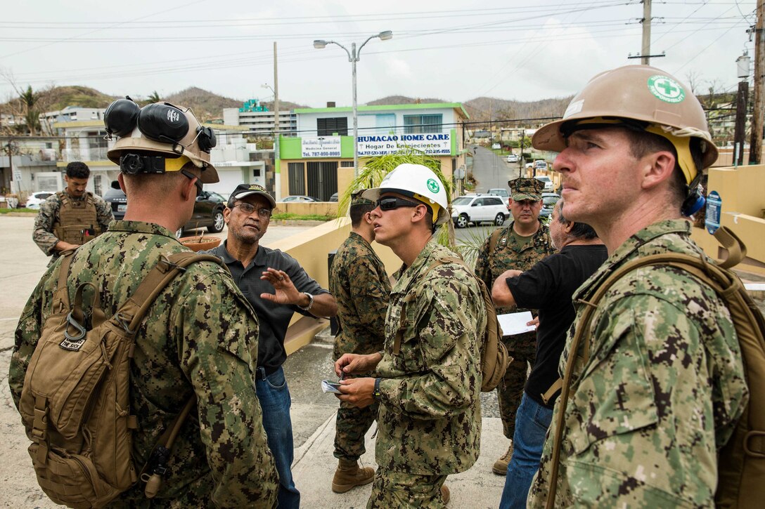 U.S. Marines and Navy corpsmen with the 26th Marine Expeditionary Unit (MEU), and Sailors with Amphibious Construction Battalion 2, speak with local civilian employees during an assessment of Hospital Oriente’s medical and operational needs as part of Hurricane Maria relief efforts at Humacao, Puerto Rico, Sept. 27, 2017. The 26th MEU is supporting the Federal Emergency Management Agency, the lead federal agency, and local authorities in Puerto Rico with the combined goal of protecting the lives and safety of those in affected areas. (U.S. Marine Corps photo by Lance Cpl. Tojyea G. Matally)
