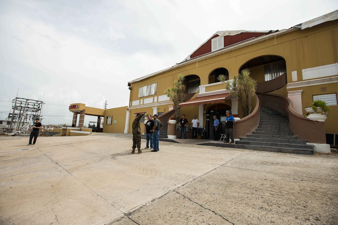 U.S. Navy Hospitalman Apprentice Judd A. Ostolaza, center, a local resident and reservist with Detachment 1, Headquarters & Services Company, 4th Marine Logistics Group (MLG), volunteering his translating services with the 26th Marine Expeditionary Unit (MEU), speaks with local civilian employees during an assessment of Hospital Oriente’s medical and operational needs as part of Hurricane Maria relief efforts at Humacao, Puerto Rico, Sept. 27, 2017. The 26th MEU is supporting the Federal Emergency Management Agency, the lead federal agency, and local authorities in Puerto Rico with the combined goal of protecting the lives and safety of those in affected areas. (U.S. Marine Corps photo by Lance Cpl. Tojyea G. Matally)