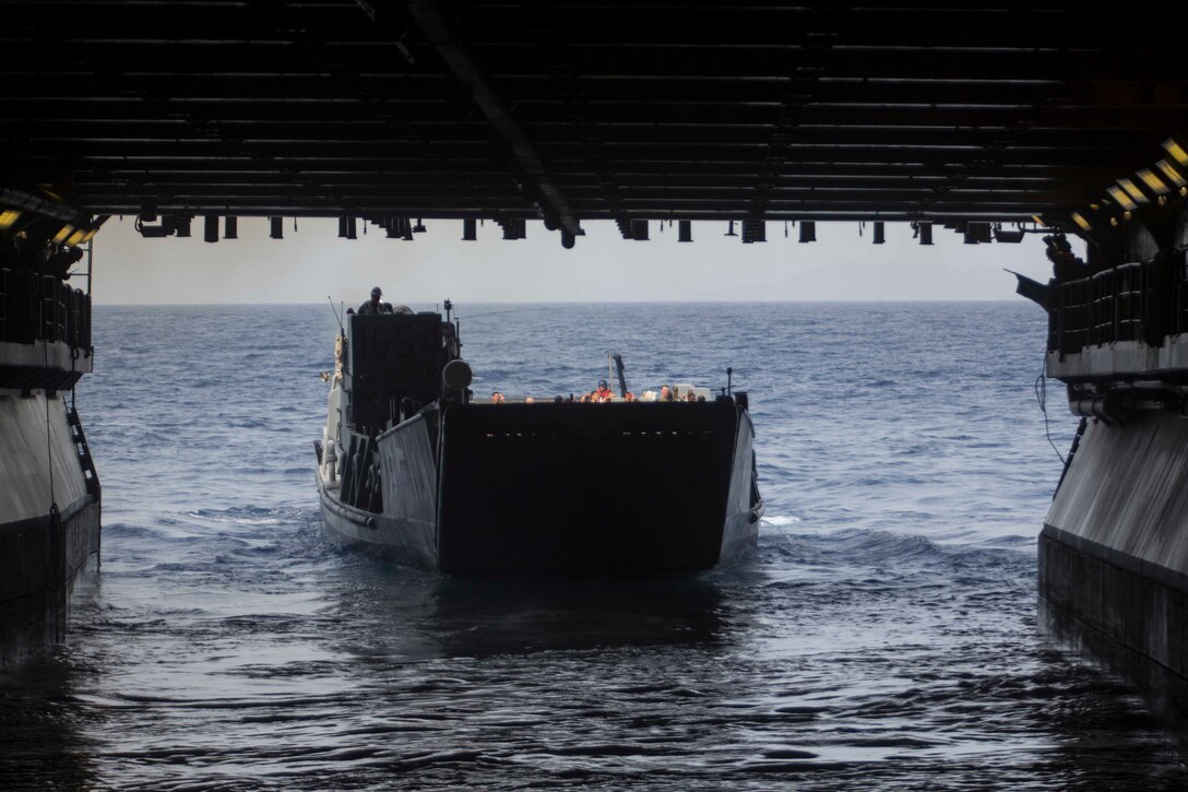 U.S. Marines with the 26th Marine Expeditionary Unit (MEU), and U.S. Navy Sailors with Expeditionary Strike Group 2, depart the amphibious assault ship USS Kearsarge (LHD 3) aboard Landing Craft, Utility 1654, to support Hurricane Maria relief efforts, in the Caribbean Sea, Sept. 27, 2017. The 26th MEU is supporting Federal Emergency Management Agency, the lead federal agency, in helping those affected by Hurricane Maria to minimize suffering and is one component of the overall whole-of-government response effort. (U.S. Marine Corps photo by Lance Cpl. Santino D. Martinez)