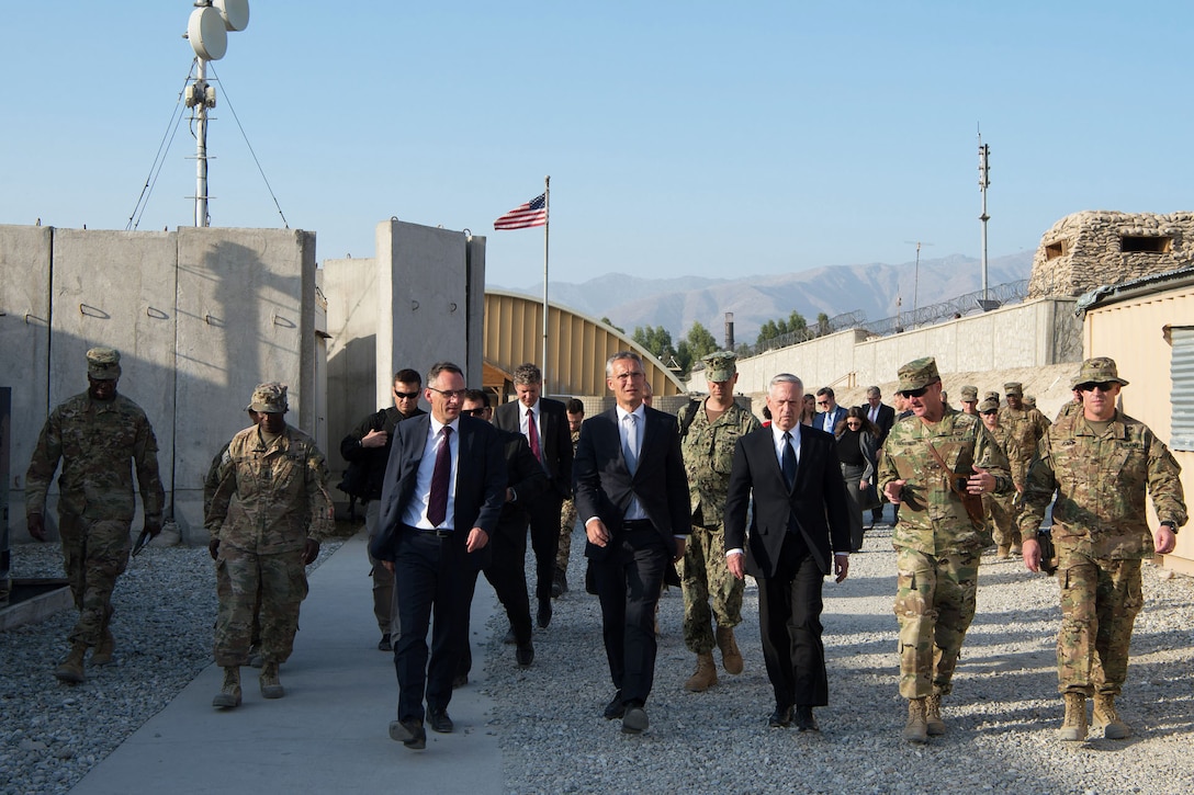 Defense Secretary Jim Mattis walks with civilian and military leaders in Afghanistan