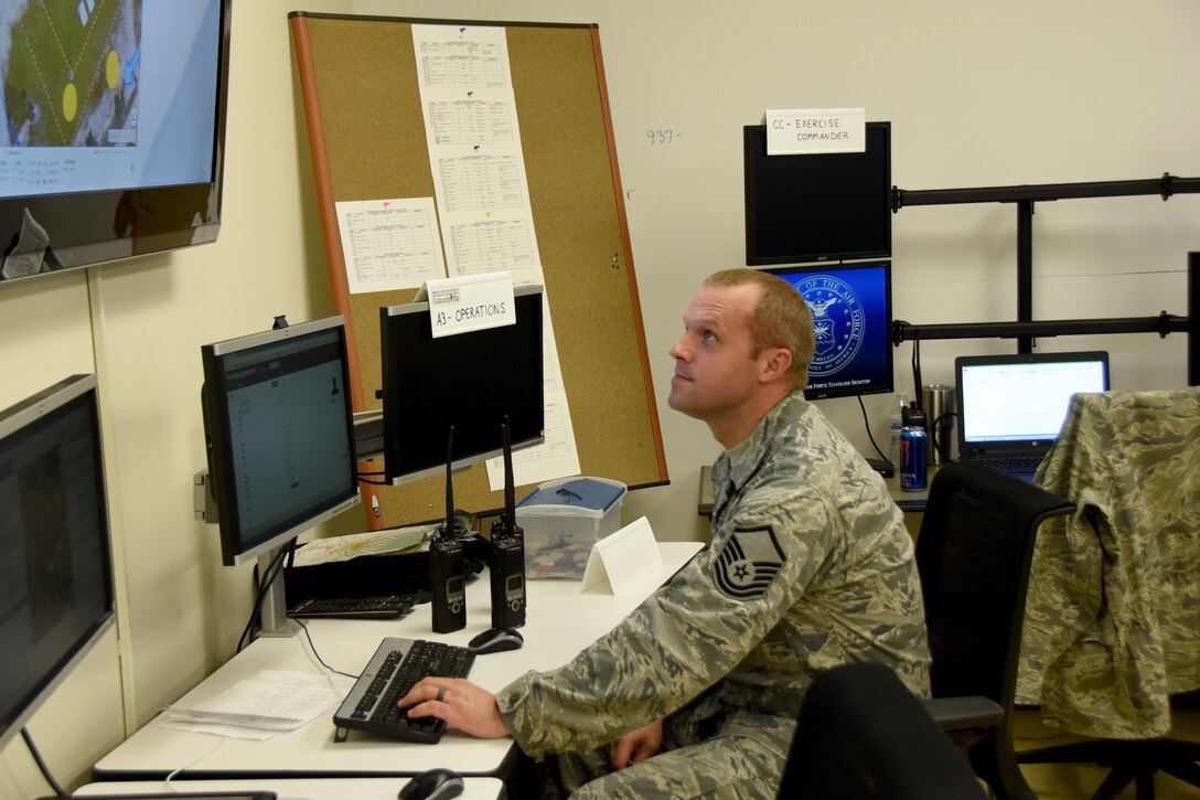 Master Sgt. Brian Lawrence, 269th Combat Communications Squadron, Springfield Ohio Air National Guard Base views a monitor displaying an aerial  view of the National Center for Medical Readiness during the Tech Warrior 2017 exercise, Fairborn, Ohio Sept. 21, 2017. The 269th CBCS is providing power, air conditioning and land mobile radio support to the 10-day exercise.