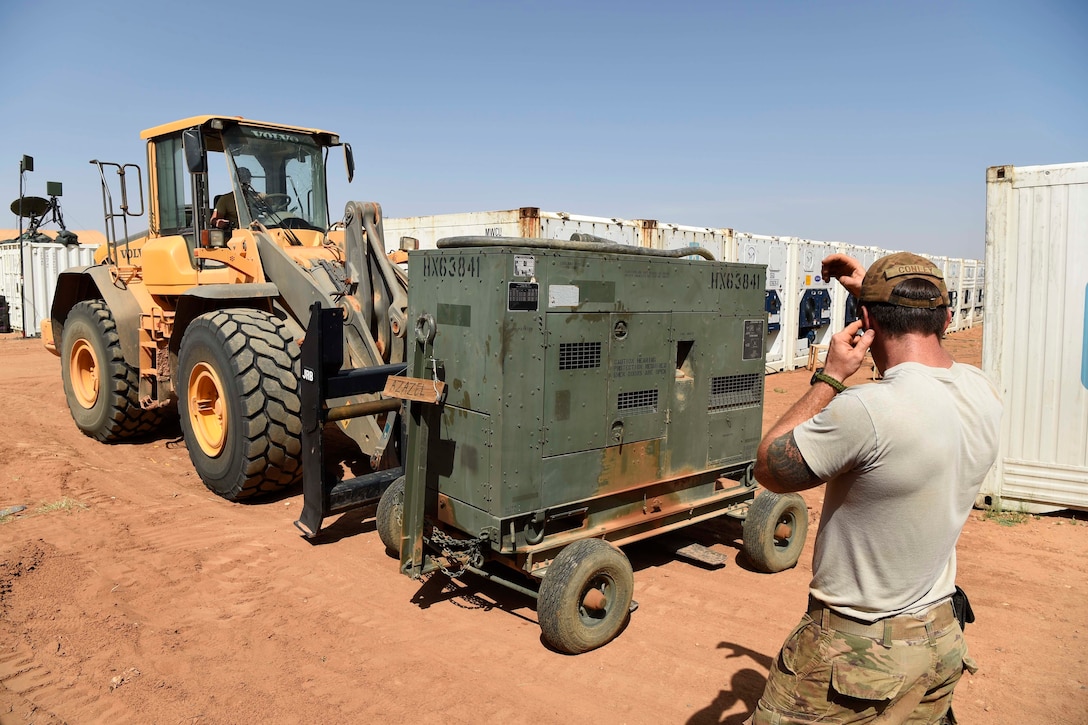 Airmen move generators from the old base.