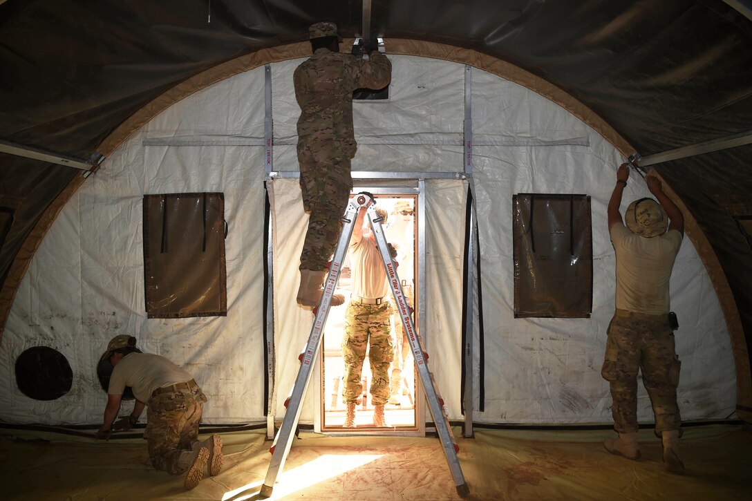 Airmen finish up taking down tents at old base.
