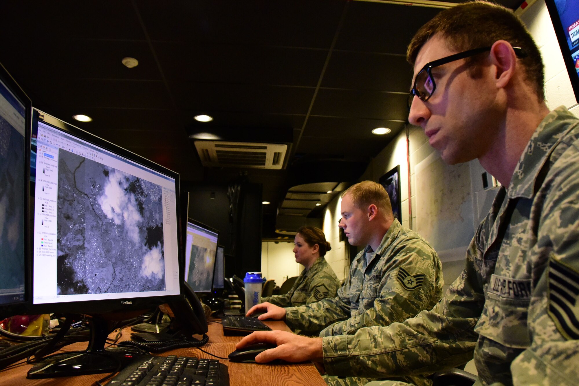 Airmen from the 118th Wing analyze damage from Hurricane Irma in the U.S. Virgin Islands from geospatial imagery on Sept. 14, 2017 at Berry Field Air National Guard Base, Nashville, Tennessee. Airmen from the 118th Wing provided valuable damage information to people working on the ground throughout the Caribbean, which helped speed up the recovery process. (U.S Air National Guard photo by Senior Airman Anthony Agosti)