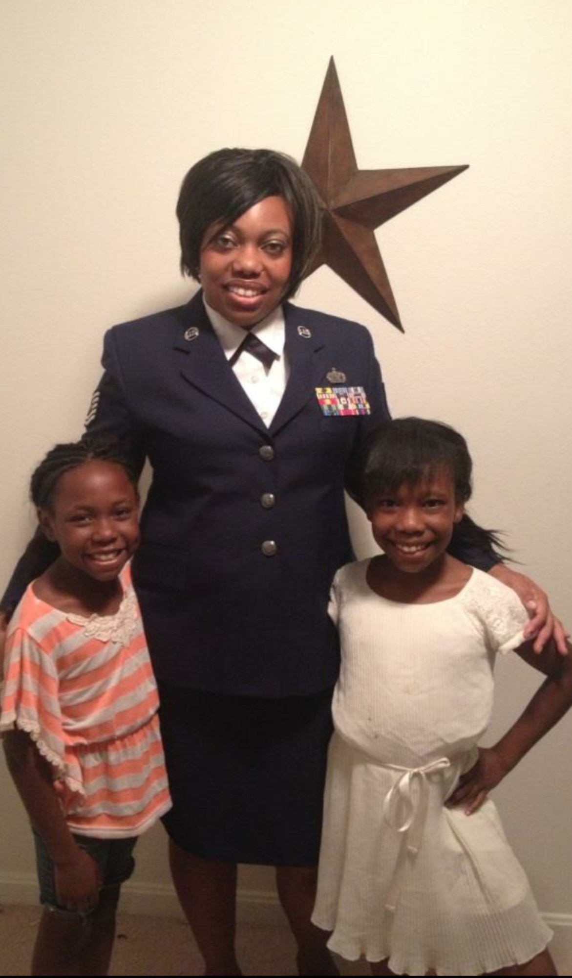 Nyla and Iyana stand with her mother, Tech. Sgt. Shonda Blanks, 375th Operations Support Squadron commander’s support staff NCOIC.
