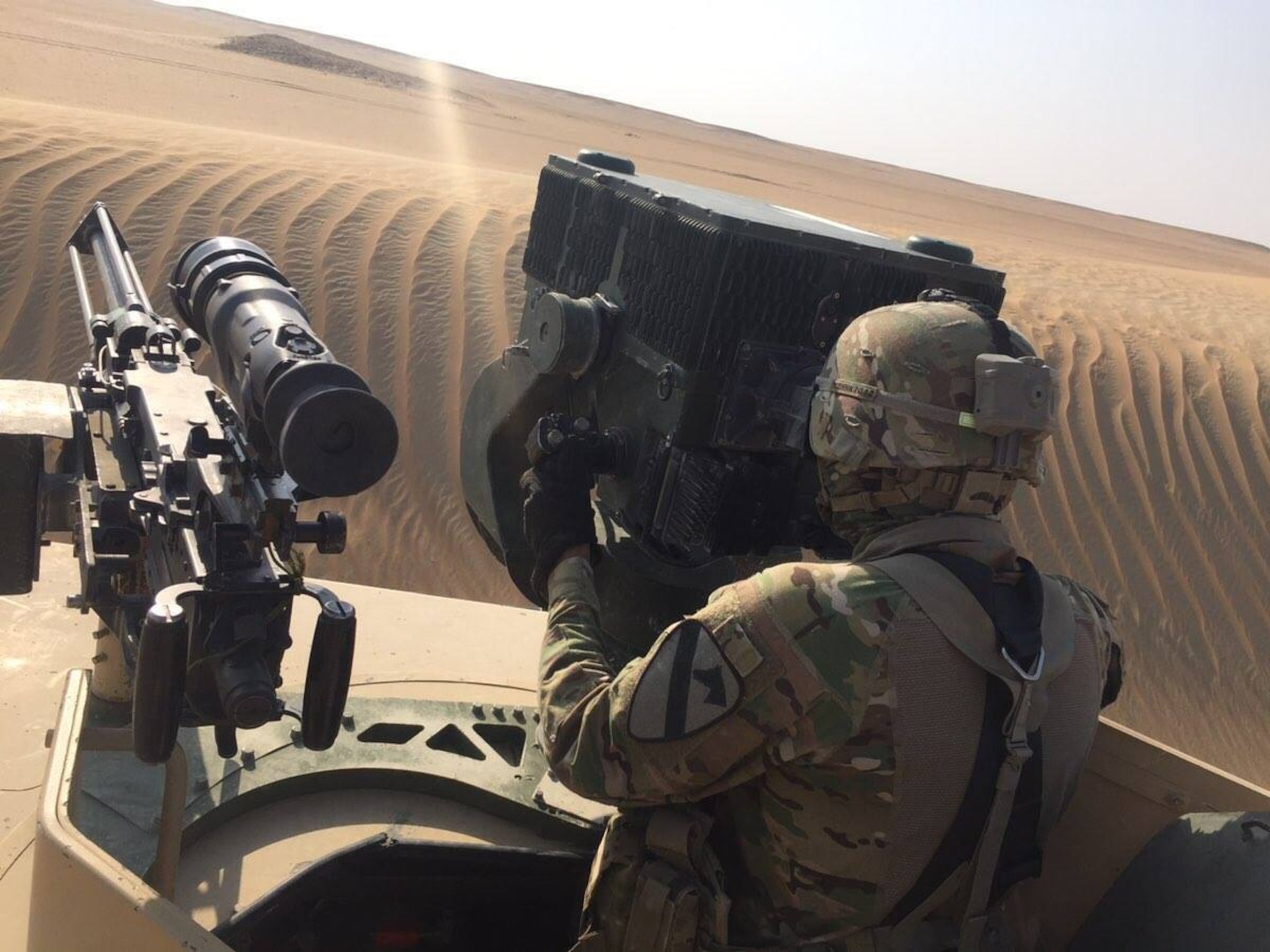 Soldier uses equipment to scan his sector during training.