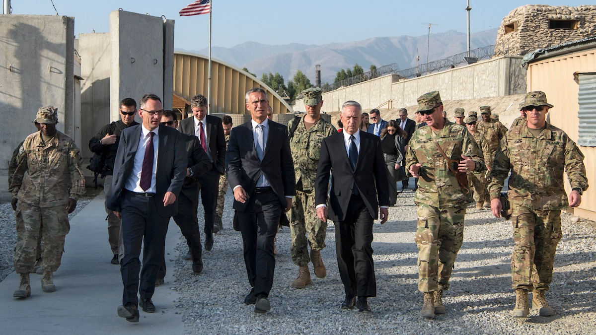 Defense Secretary James N. Mattis walks with civilian and military leaders in Afghanistan.