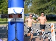 Second Lts. Dennis Cook and Forrest Schaffer, 14th Student Squadron student pilots, finish the triathlon Sept. 23, 2017, on Columbus Air Force Base, Mississippi. Some student pilots competed in pairs or groups, using the Saturday event to socialize and exercise. (U.S. Air Force photo by Airman 1st Class Keith Holcomb)