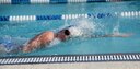 Second Lt. Brooke Cecil, 14th Comptroller Squadron Financial Services Flight Commander, begins her 300-meter swim during the base triathlon Sept. 23, 2017, on Columbus Air Force Base, Mississippi. After the 300-meter swim participants in the triathlon then biked 22 kilometers and ran a 5K. (U.S. Air Force photo by Airman 1st Class Keith Holcomb)