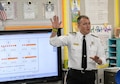 Will O’Meara, 14th Civil Engineer Squadron Health and Safety Officer, speaks to a first-grade classroom at Caledonia Elementary School Sept. 26, 2017, in Caledonia, Mississippi. Fire and emergency service members from Columbus Air Force Base, Mississippi, went to the school to bring recognition to Fire Prevention Week. The week places emphasis on a number of items such as checking fire detectors and knowing who to call in case of an emergency along with many other prevention and safety measures. (U.S. Air Force photo by Staff Sgt. Christopher Gross)