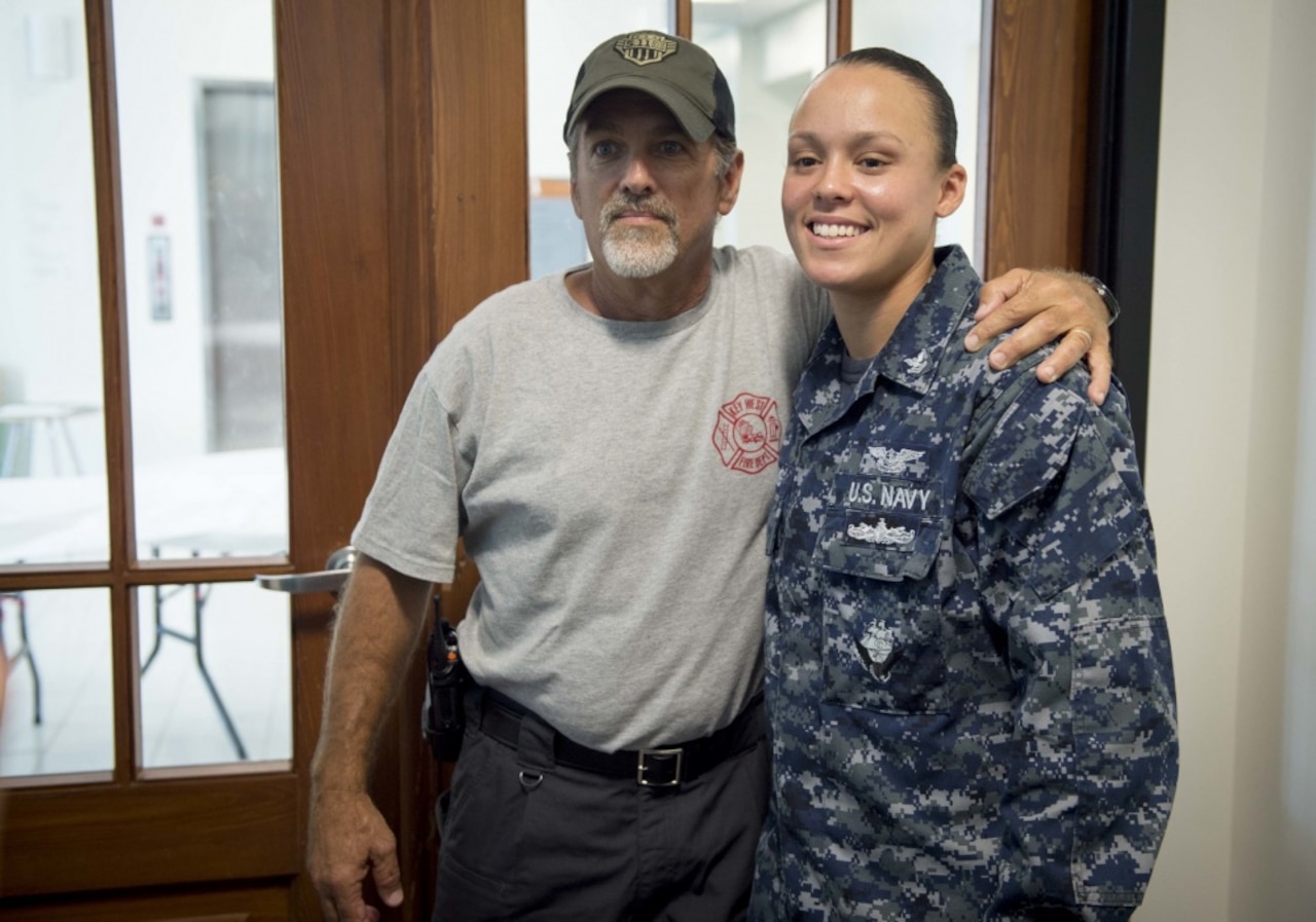 Sailor poses with hometown friend