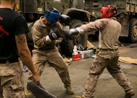 U.S. 5th FLEET AREA OF OPERATIONS (Sept. 22, 2017) – Cpl. Santiago Garces and Cpl. Rigger Velasquez both Light Armored Reconnaissance vehicle crewmen with 1st Battalion, 5th Marine Regiment, the 15th Marine Expeditionary Unit’s Battalion Landing Team spar during a green belt course part of the Marine Corps Martial Arts Program aboard the amphibious dock landing ship USS Pearl Harbor (LSD 52).  The 15th Marine Expeditionary Unit is embarked on the America Amphibious Ready Group and is deployed to maintain regional security in the U.S. 5th Fleet area of operations. (U.S. Marine Corps photo by Cpl. F. Cordoba)