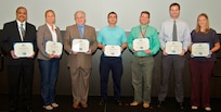 IMAGE: DAHLGREN, Va. - Ajoy Muralidhar, Kathleen Jones, William Catoe, David Fredrickson, David Shuttleworth, Joseph Carter, and Jessica Hildebrand, (l to r), are pictured with their certificates of achievement at the 2017 Naval Surface Warfare Center Dahlgren Division (NSWCDD) academic awards ceremony. The government civilians were among 13 employees selected for the fiscal year 2018 Academic Fellowship Program. The competitive program accelerates academic and professional growth of employees and contributes to the increase in degrees awarded at Dahlgren. This year, nine of the selected employees are progressing in their master’s degree programs in fields of study that include cyber security engineering, business administration, systems engineering, engineering management, and computer science. One selected employee is working on a bachelor's degree in physics through the program. The command’s academic fellowship program is also helping three engineers complete doctoral degree programs - one in electrical engineering, another in engineering management and systems engineering, and the third in modeling and simulation.