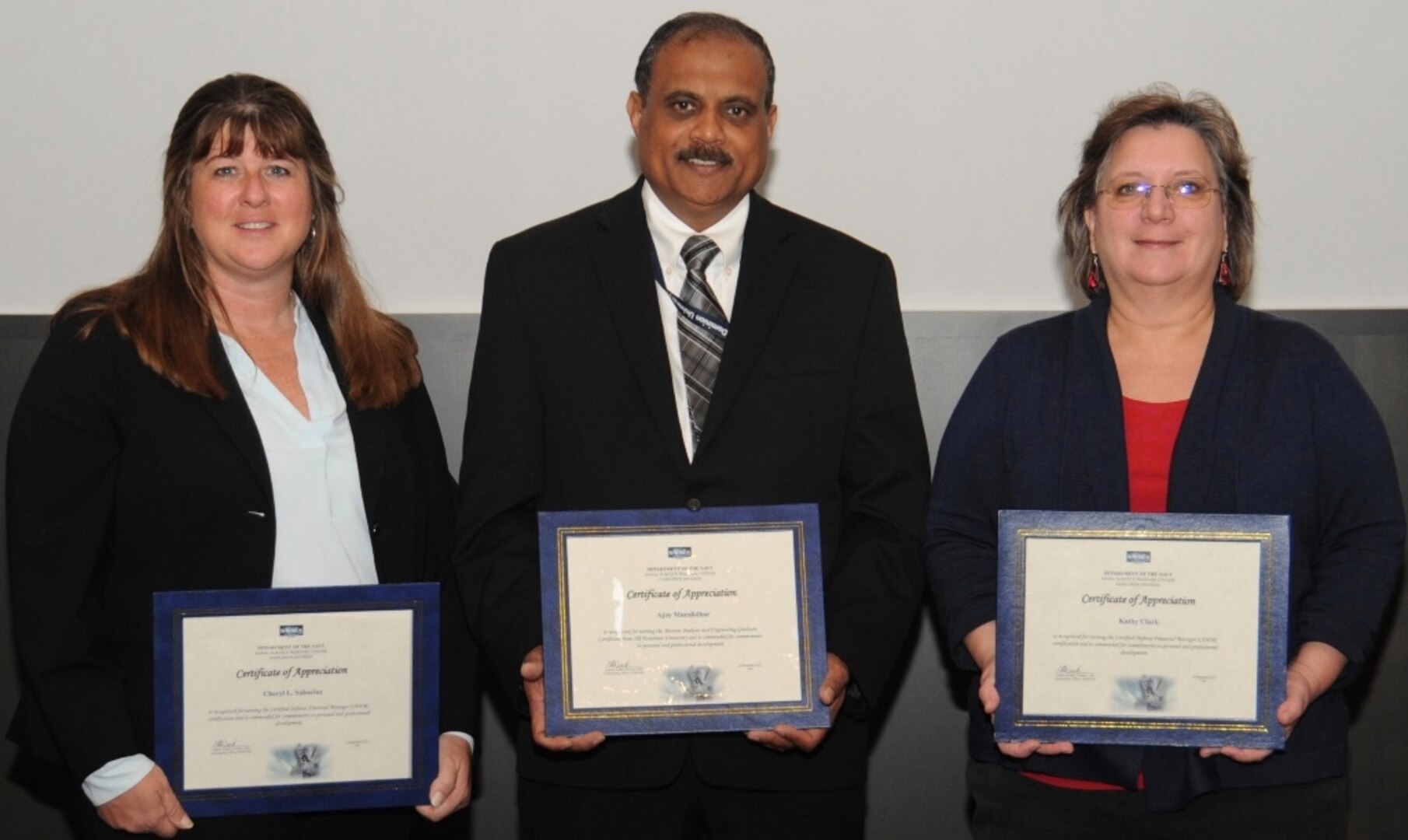 IMAGE: DAHLGREN, Va. - Cheryl Subacius, Ajoy Muralidhar, and Kathy Clark, (l to r), are pictured with their certificates of achievement at the 2017 Naval Surface Warfare Center Dahlgren Division (NSWCDD) academic awards ceremony. Subacius was recognized for completing her defense financial manager certification from the American Society of Military Comptrollers. Muralidhar was recognized for completing his graduate certificate in mission analysis and engineering from Old Dominion University. Clark was recognized for completing her defense financial manager certification from the American Society of Military Comptrollers.