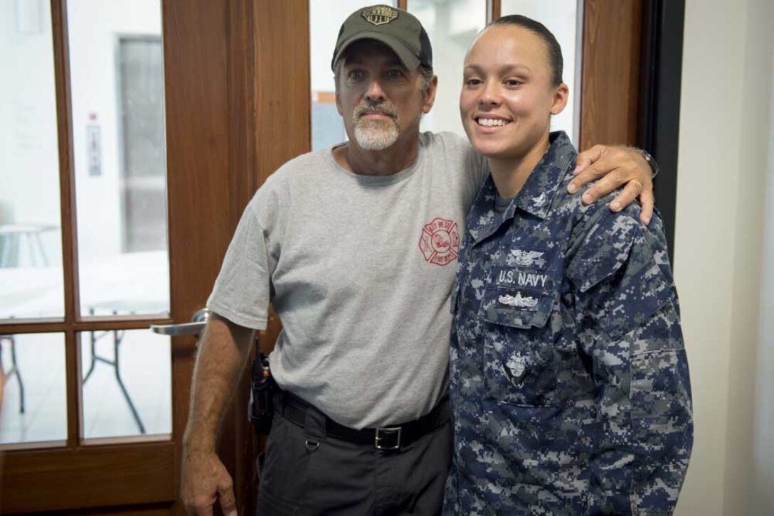 A sailor poses with an old friend.