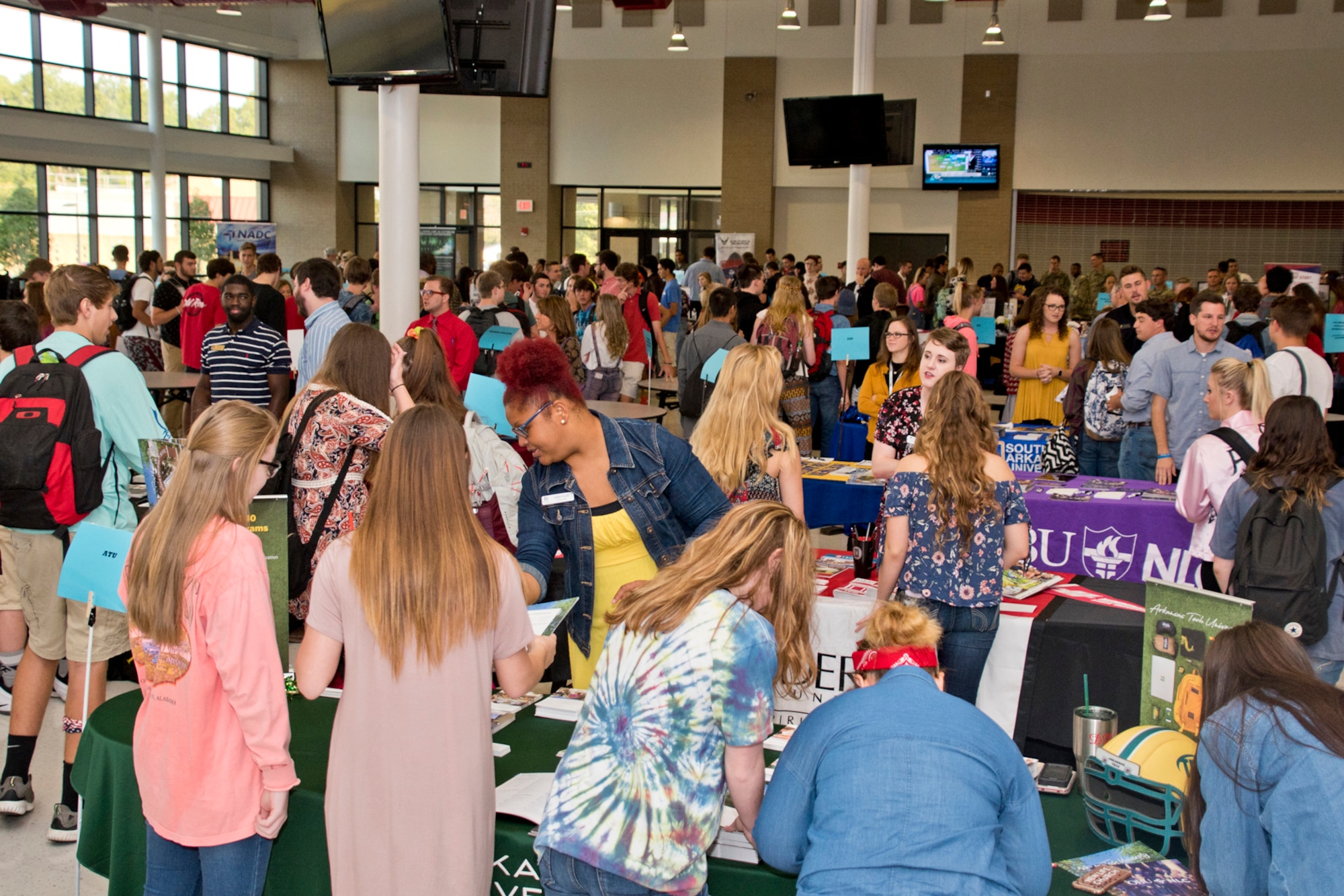 High school students gather information for future careers during the annual Cabot College and Career Fair at Cabot High School in Cabot, Ark., Sept. 28, 2017. Career Fairs allow students to converse with potential future employers and start considering career paths. (U.S. Air Force photo by Master Sgt. Jeff Walston/Released)