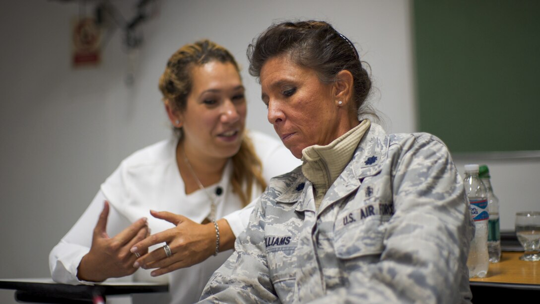 U.S. Air Force Lt. Col. Kellie Williams, 12th Air Force (AFSOUTH) Deputy Command Surgeon, speaks with an Argentinian counterpart during a senior leader engagement as part of the Department of Defense State Partnership Program Sep. 20 at the National Institute of Aeronautical and Space Medicine, Argentina.