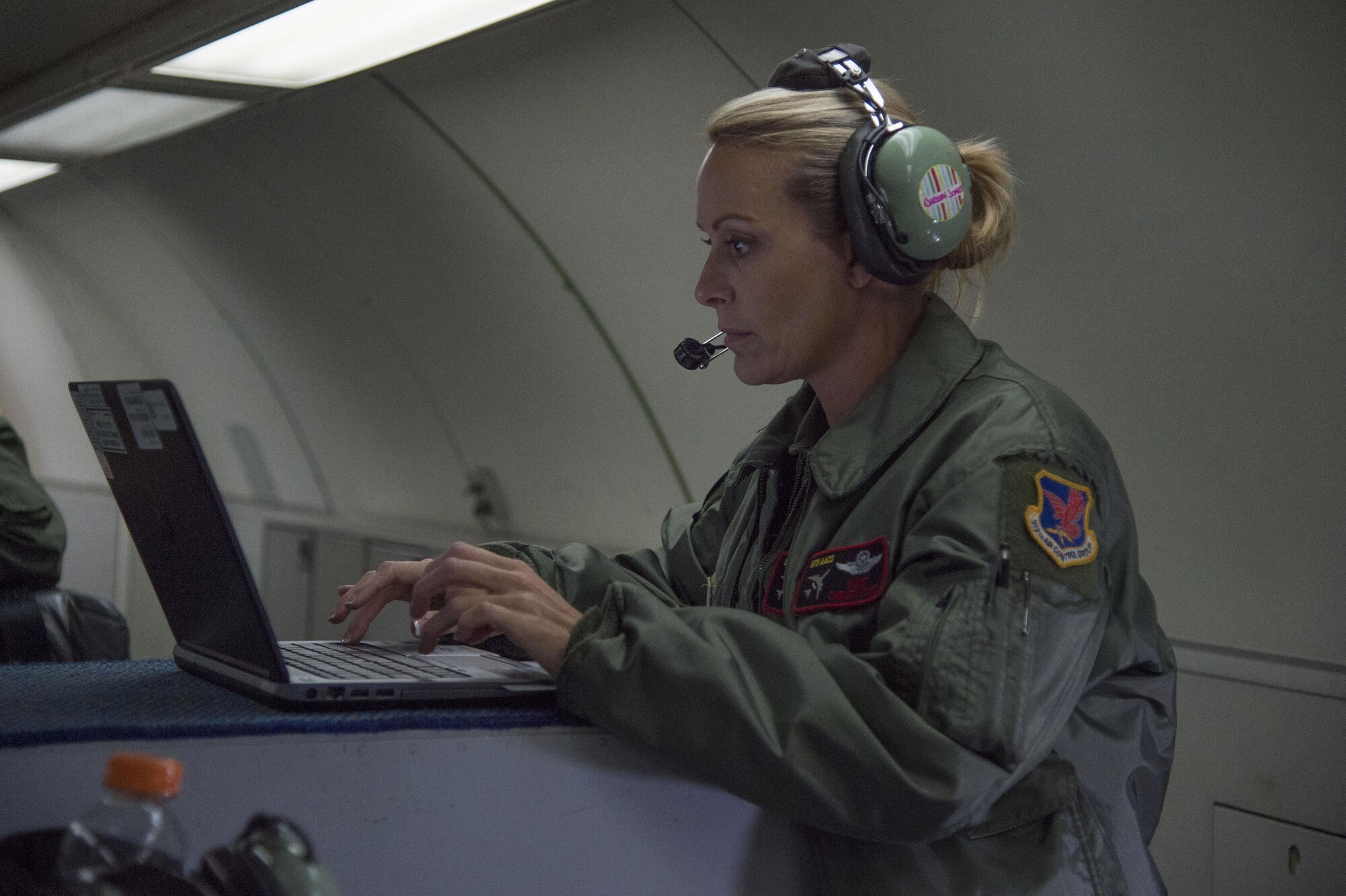 Air Force Master Sgt. Christy Jones, 970th Airborne Air Control Squadron, participates in a surveillance training mission on board an E-3 Sentry Airborne Warning and Control aircraft Sept. 20, 2017. Reservists from the 970th AACS based at Tinker Air Force Base, Okla., visited Joint Base Elmendorf-Richardson for a nine-day total force mission where they fully integrated with the active-duty 962nd AACS.