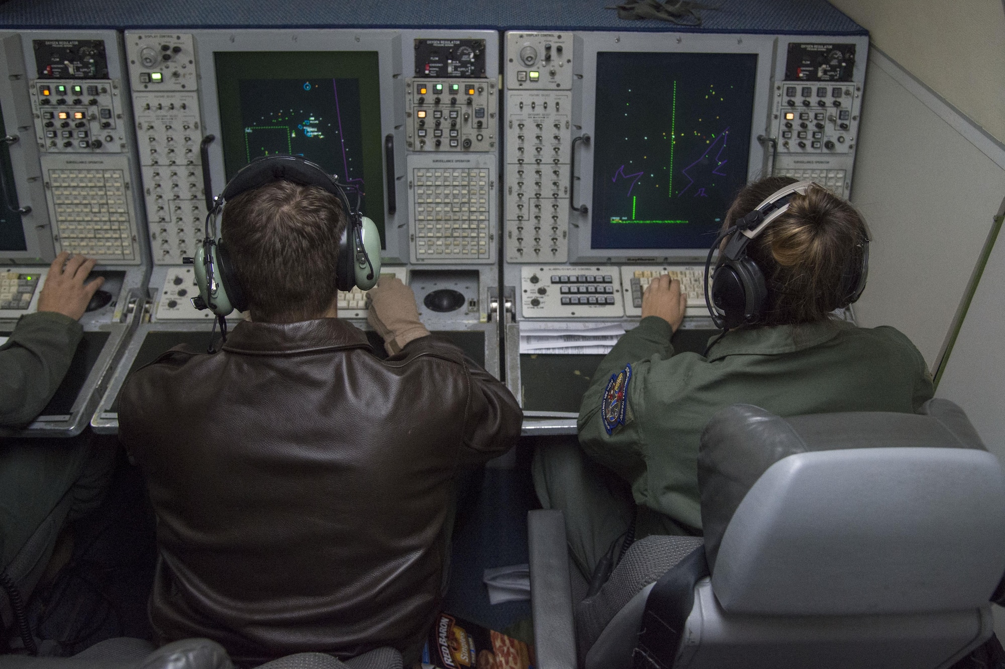 Airmen from the 962nd Airborne Air Control Squadron and 970th AACS work together to complete a surveillance training mission on board an E-3 Sentry Airborne Warning and Control aircraft, Sept. 20, 2017. Reservists from the 970th AACS based at Tinker Air Force Base, Okla., visited Joint Base Elmendorf-Richardson for a nine-day total force mission where they fully integrated with the active-duty 962nd AACS.