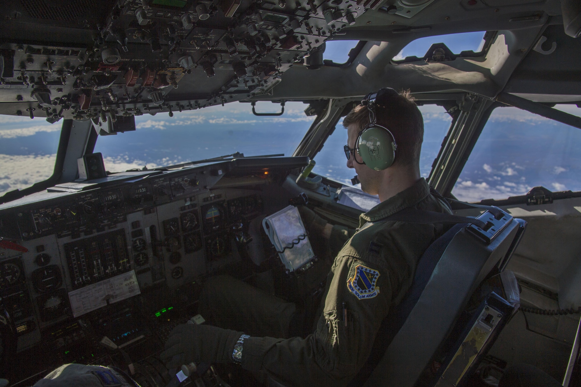 A pilot assigned to the 962nd Airborne Air Control Squadron flies an E-3 Sentry Airborne Warning and Control aircraft during a surveillance training mission above Alaska, Sept. 20,2017. Reservists from the 970th AACS based at Tinker Air Force Base, Okla., visited Joint Base Elmendorf-Richardson for a nine-day total force mission where they fully integrated with the active-duty 962nd AACS.