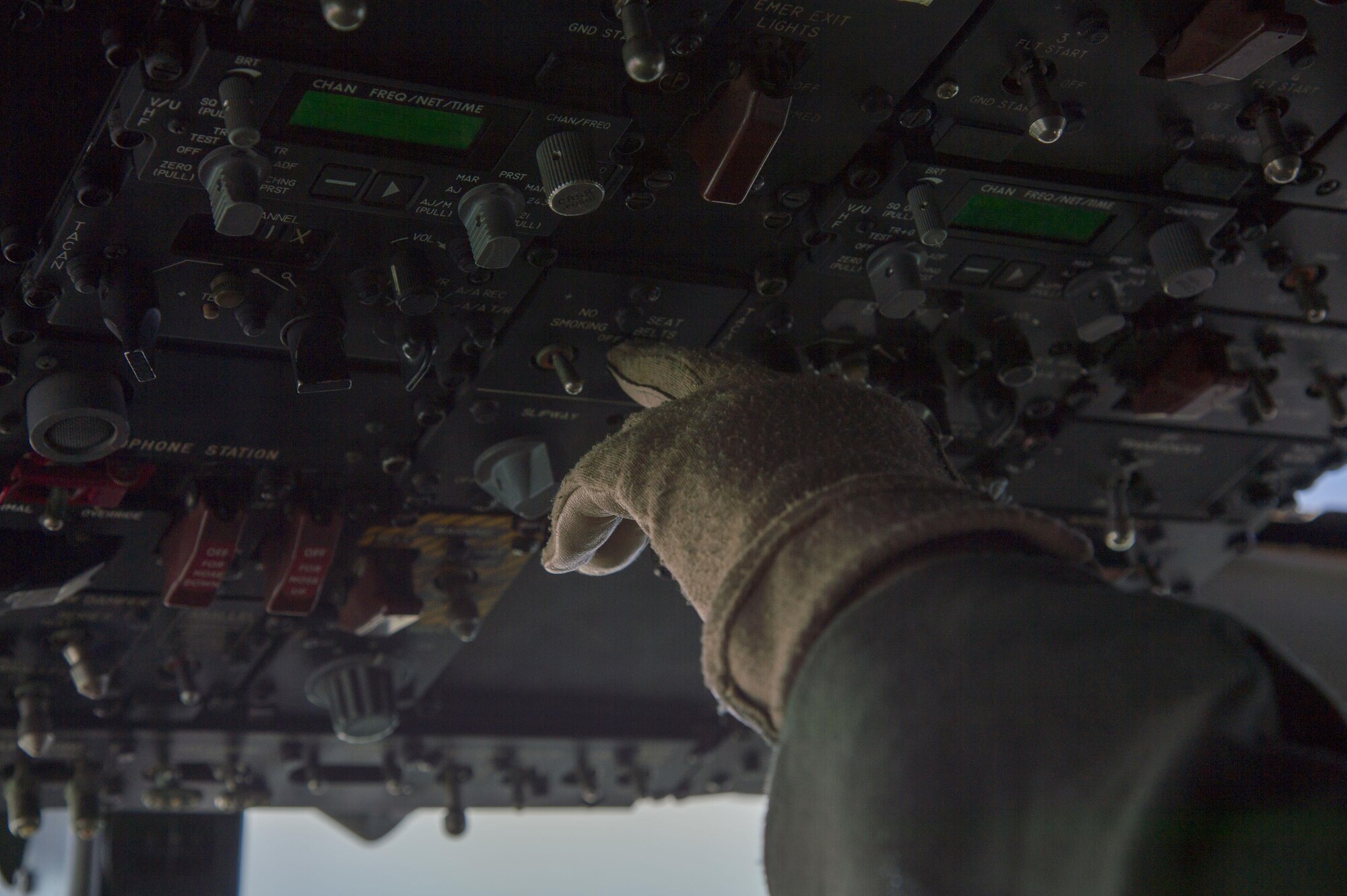 An engineer checks the gauges of an E-3 Sentry Airborne Warning and Control aircraft during a surveillance training mission above Alaska Sept. 20, 2017. Reservists from the 970th Airborne Air Control Squadron based at Tinker Air Force Base, Okla., visited Joint Base Elmendorf-Richardson for a nine-day total force mission where they fully integrated with the active-duty 962nd AACS.