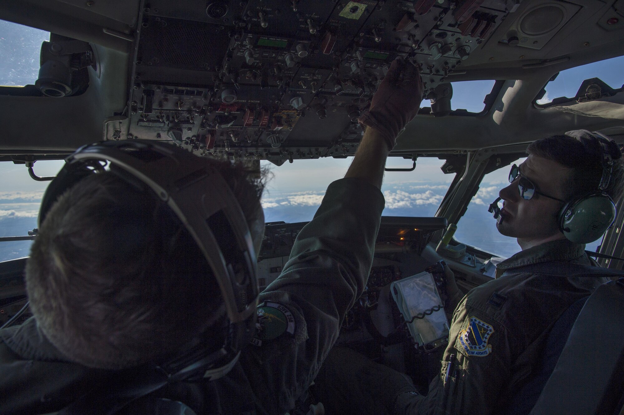 Pilots on an E-3 Sentry Airborne Warning and Control aircraft check gauges while flying above Alaska, during a surveillance training mission Sept. 20, 2017. Reservists from the 970th Airborne Air Control Squadron based at Tinker Air Force Base, Okla., visited Joint Base Elmendorf-Richardson for a nine-day total force mission where they fully integrated with the active-duty 962nd AACS.
