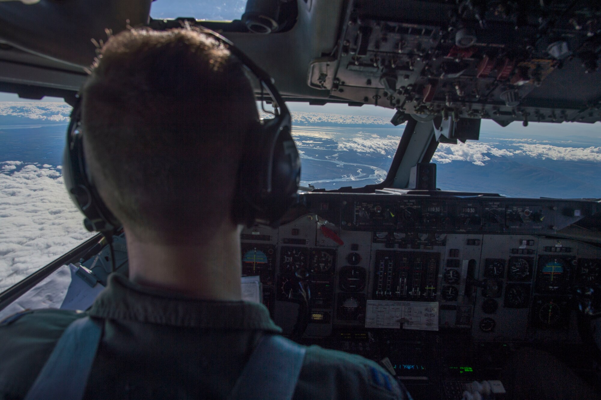 Air Force Capt. Joshua Johnson, 962nd Airborne Air Control Squadron instructor pilot, flies above Alaska in an E-3 Sentry Airborne Warning and Control aircraft during a surveillance training mission Sept. 20, 2017. Reservists from the 970th AACS based at Tinker Air Force Base, Okla., visited Joint Base Elmendorf-Richardson for a nine-day total force mission where they fully integrated with the active-duty 962nd AACS.