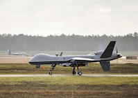An MQ-9 Reaper remotely piloted aircraft prepares to take off