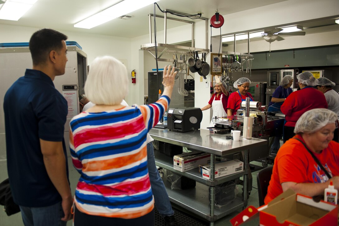 Barbara Riley, vocational services director, gives U.S. Air Force Col. Ricky Mills, 17th Training Wing commander, a tour of the Meals for the Elderly kitchen San Angelo, Texas, Sept. 27, 2017. Meals for the Elderly is a private, non-profit charitable organization devoted to serving the homebound elderly of San Angelo by delivering a warm meal to those enrolled in the program. (U.S. Air Force photo by Senior Airman Scott Jackson/Released)