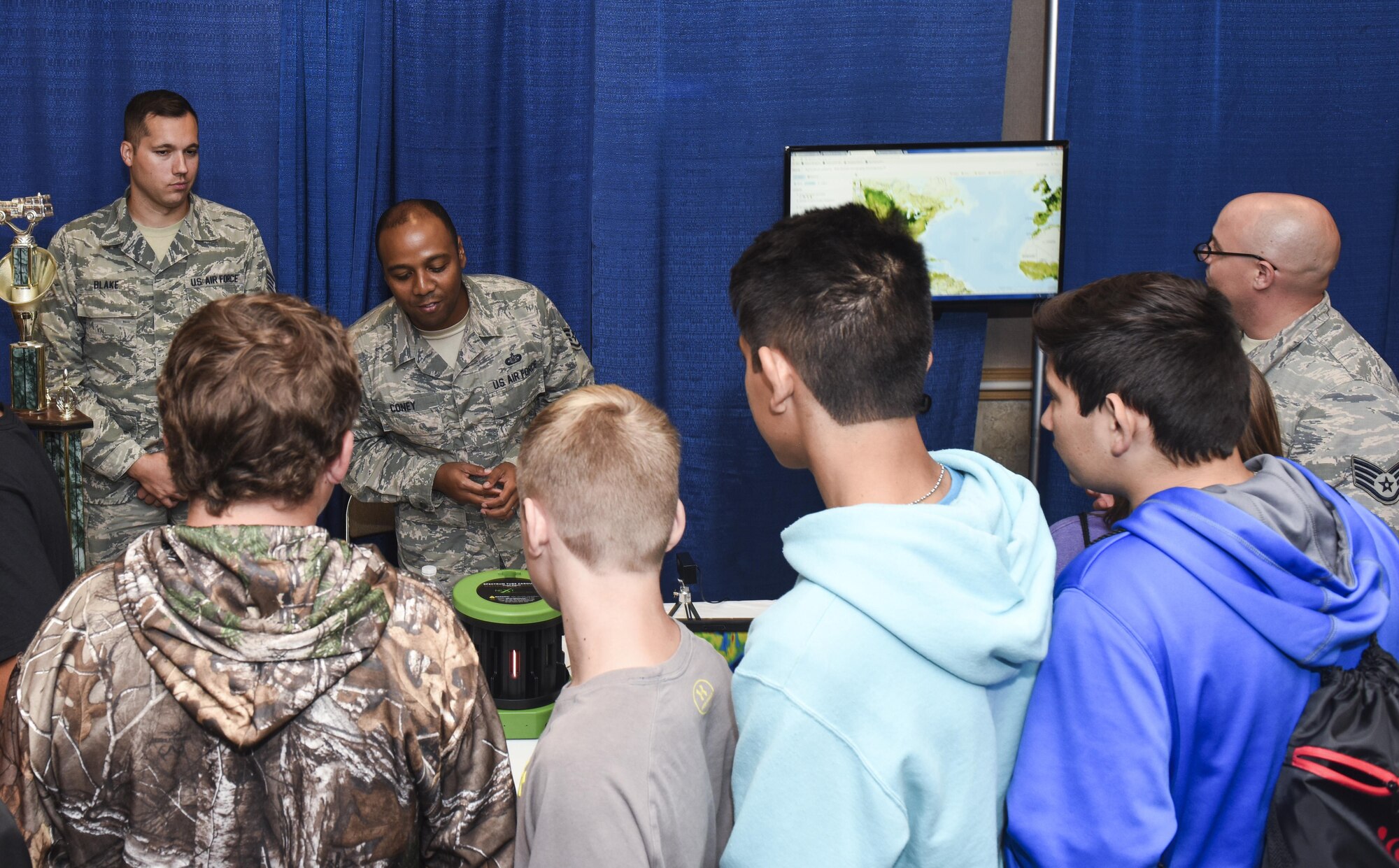 U.S. Air Force Staff Sgt. Ernest Coney, 312th Training Squadron instructor, explains to a group of Sterling City eighth graders how the seismometer measures vibrations in the earth during the Annual Business expo at the McNease Convention Center in San Angelo, Texas, Sept. 27, 2017. Goodfellow Air Force Base provided representatives from the fire academy and the 312th TRS to speak to students about potential career fields in the Air Force. (U.S. Air Force photo by Aryn Lockhart/Released)