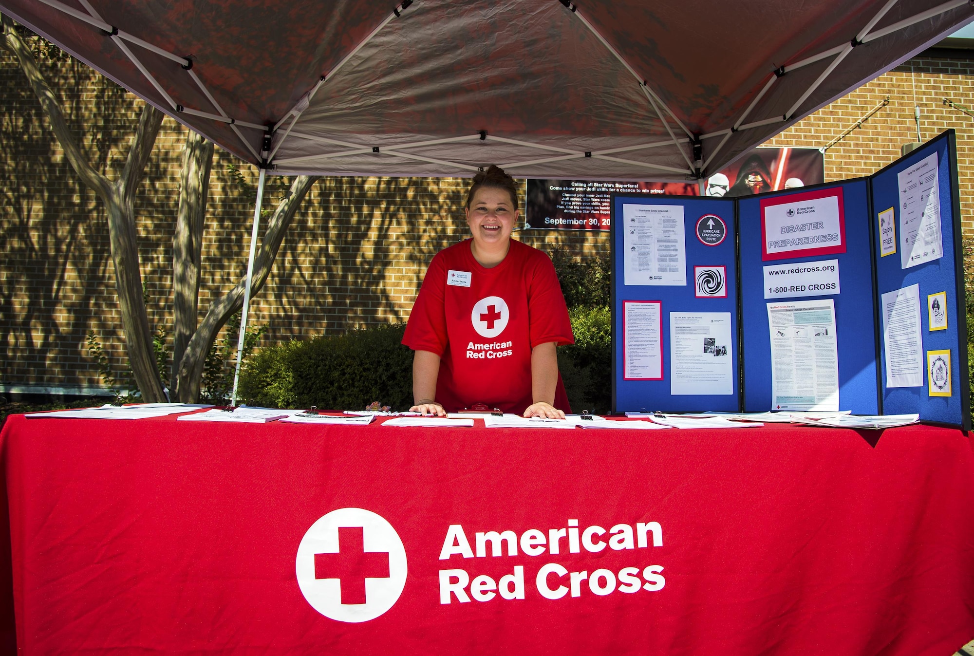 Amber Meza, American Red Cross (ARC) volunteer, poses for a picture during the National Preparedness event, Sept. 27, 2017, at Moody Air Force Base, Ga. Members from the 23d Civil Engineer Squadron partnered with the ARC to raise awareness and provide information for how to better prepare for natural disasters. (U.S. Air Force photo by Airman Eugene Oliver)