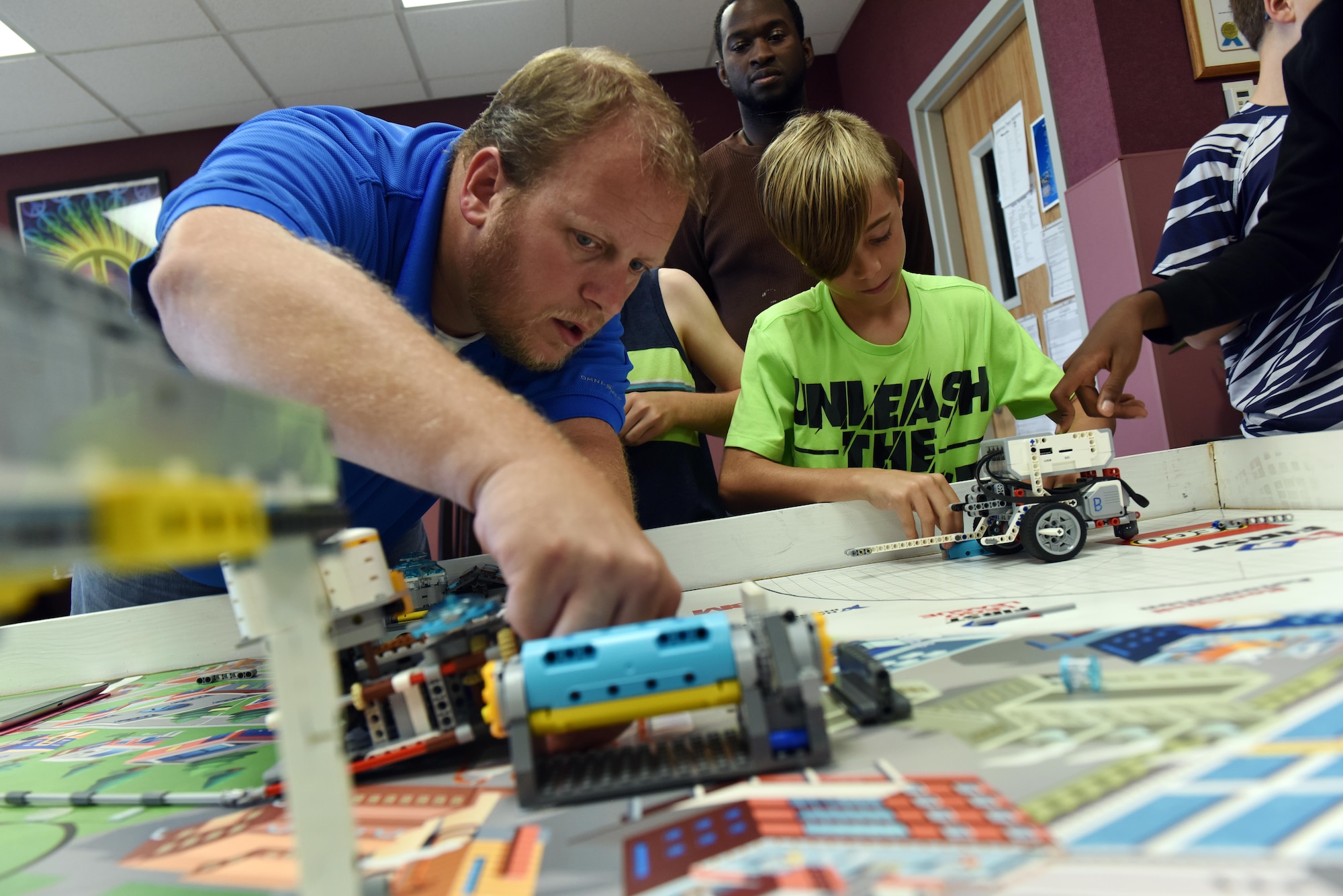 Members of Whiteman’s FIRST® LEGO® robotics team practice clearing course objectives and course movements at Whiteman Air Force Base, Mo., Sept. 21, 2017.