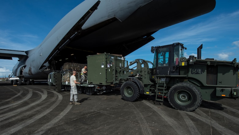 The 821st Contingency Response Group equipment is offloaded from a C-17 Globemaster lll from Travis Air Force Base Calif., at Roosevelt Roads, Puerto Rico, Sept. 26, 2017. A 70 member contingency response element from the 821st Contingency Response Group stationed at Travis Air Force Base, Calif., deployed to Puerto Rico in support of Hurricane Maria relief efforts. (U.S. Air Force photo by Staff Sgt. Robert Hicks)