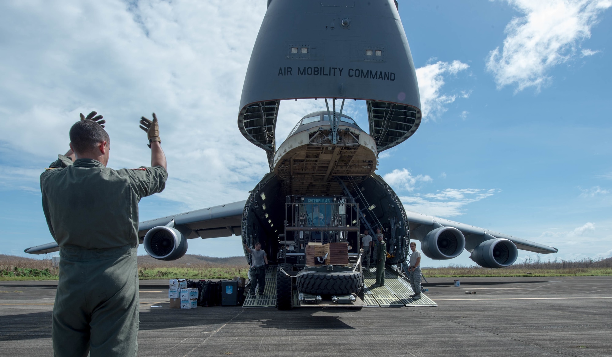 The 821st Contingency Response Group equipment is offloaded from a C-5M Super Galaxy from Travis Air Force Base Calif., at Roosevelt Roads, Puerto Rico, Sept. 25, 2017. A 70 member contingency response element from the 821st Contingency Response Group stationed at Travis Air Force Base, Calif., deployed to Puerto Rico in support of Hurricane Maria relief efforts. (U.S. Air Force photo by Staff Sgt. Robert Hicks)