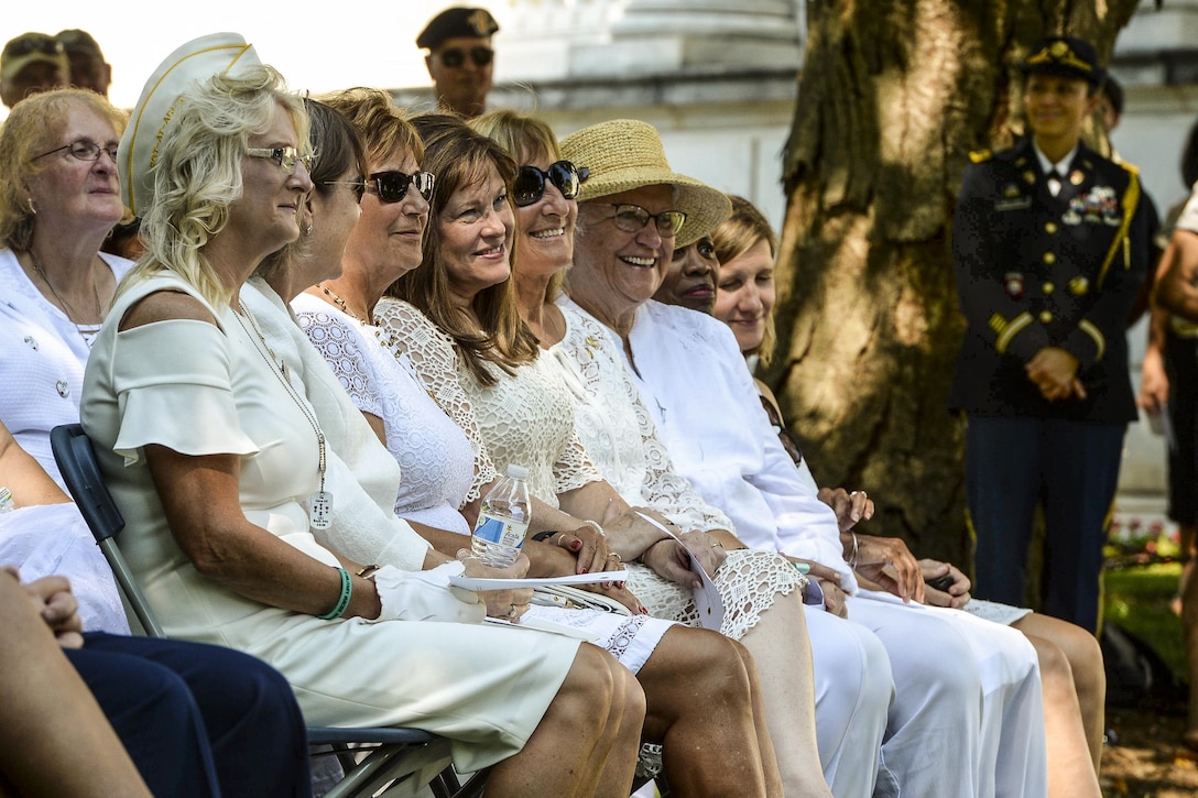 Gold Star mothers sit during a wreath-laying ceremony.