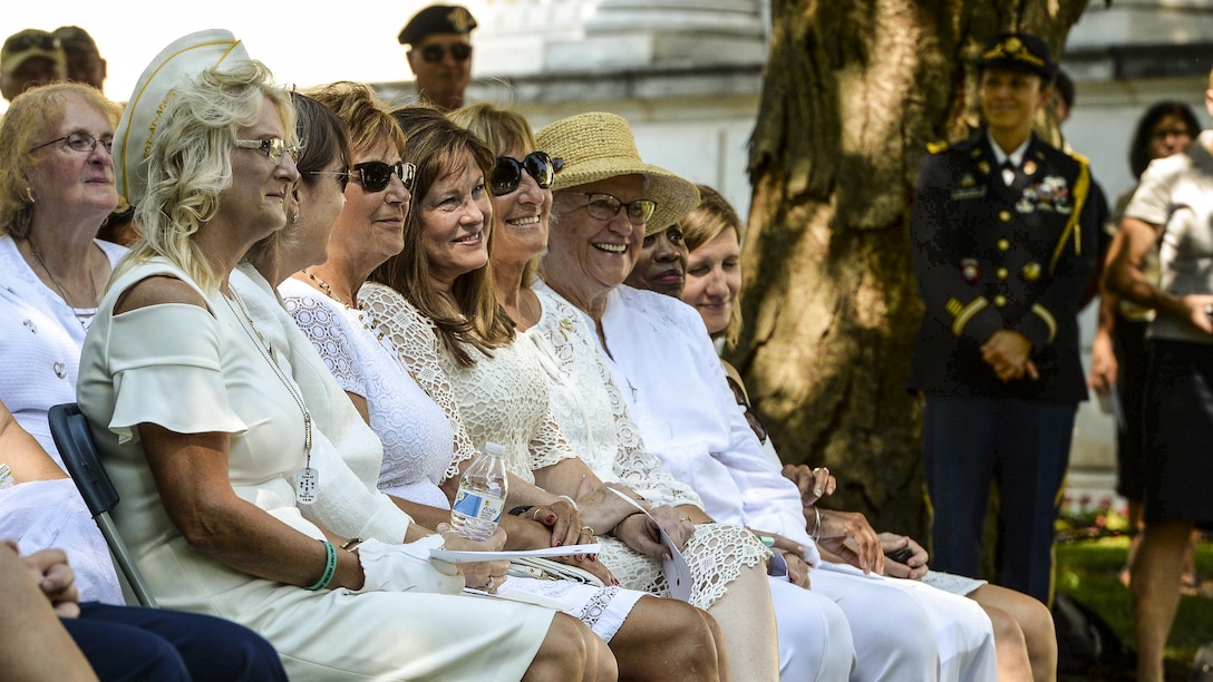 Gold Star mothers sit during a wreath-laying ceremony.