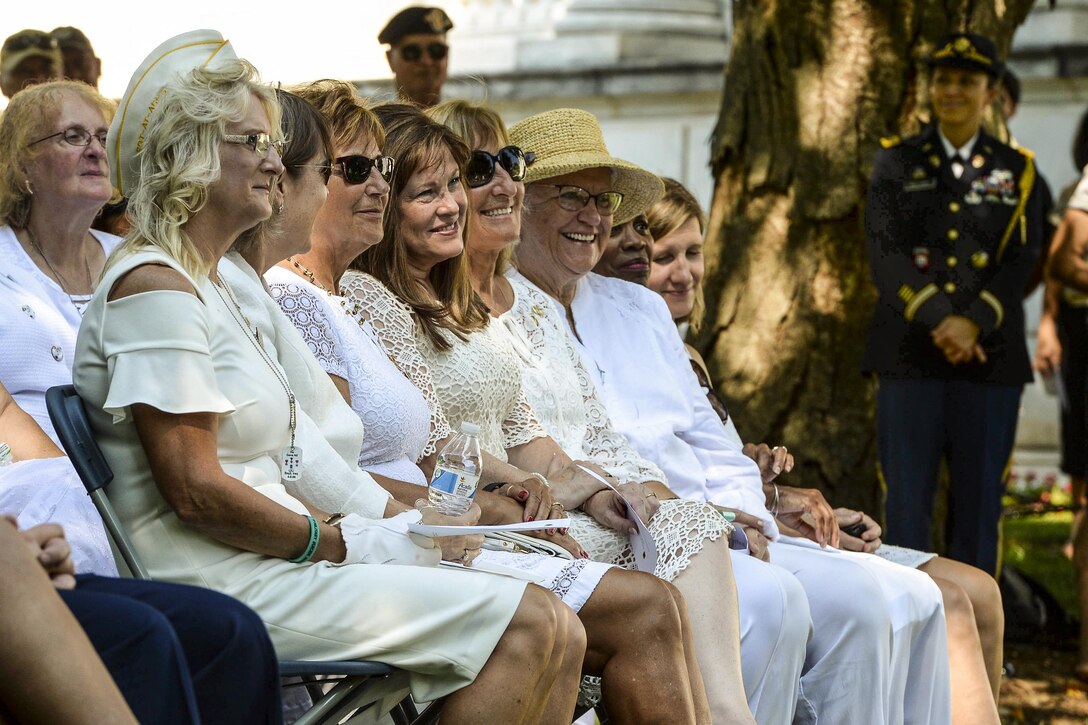 Gold Star mothers sit during a wreath-laying ceremony.