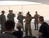 U.S. Air Force Senior Airman Alexandra Haytasingh, center, sub-committee lead for Operation Community with the First 4 professional organization, gives a safety brief to volunteers prior to starting base cleanup efforts at Al Udeid Air Base, Qatar, Sept. 1, 2017.