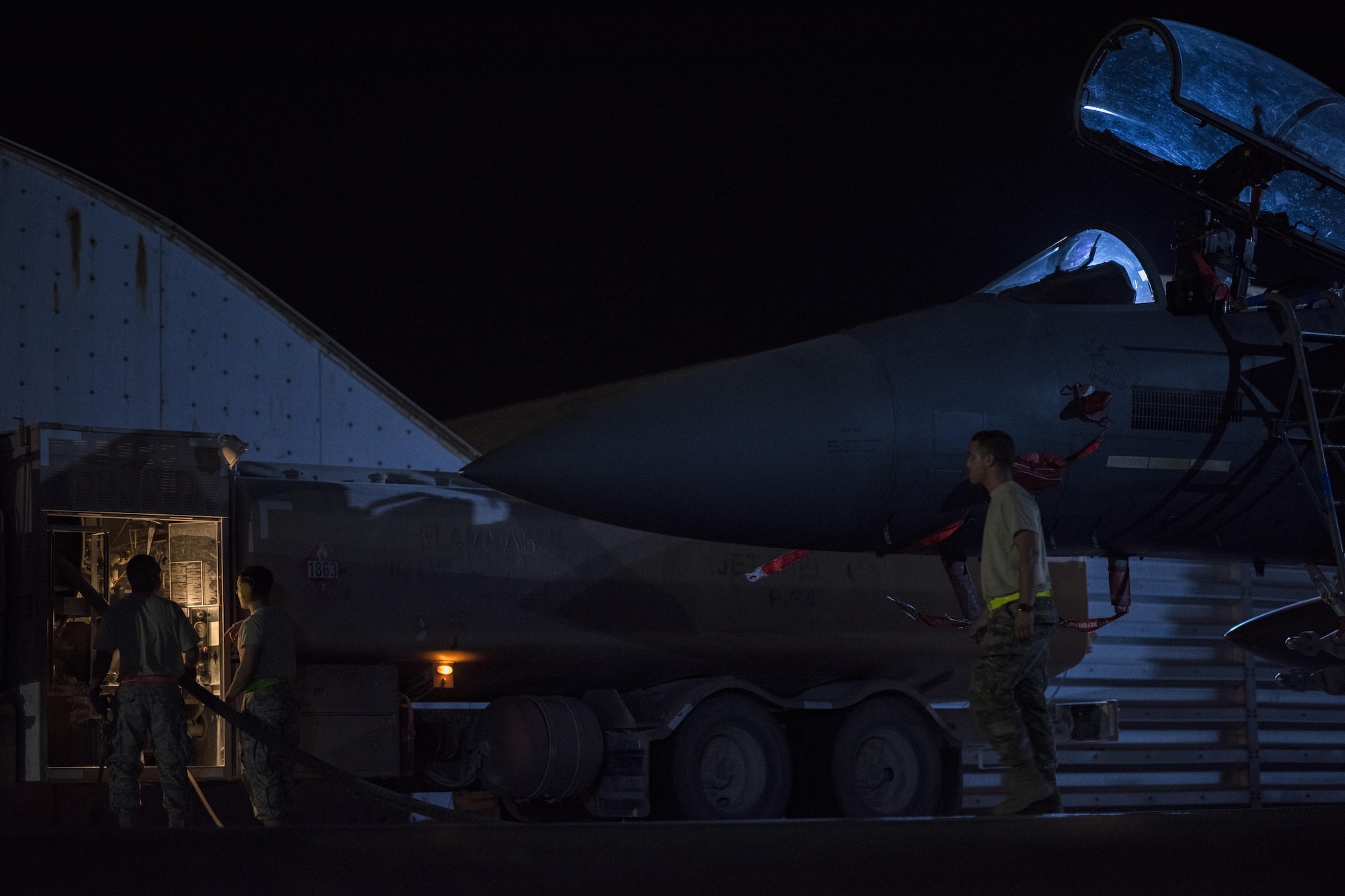 Airmen assigned to the 332nd Expeditionary Logistics Readiness Squadron defuel and F-15E Strike Eagle, July 21, 2017, in Southwest Asia. Defueling allows an aircraft to go through a thorough inspection. (U.S. Air Force photo/Senior Airman Damon Kasberg)