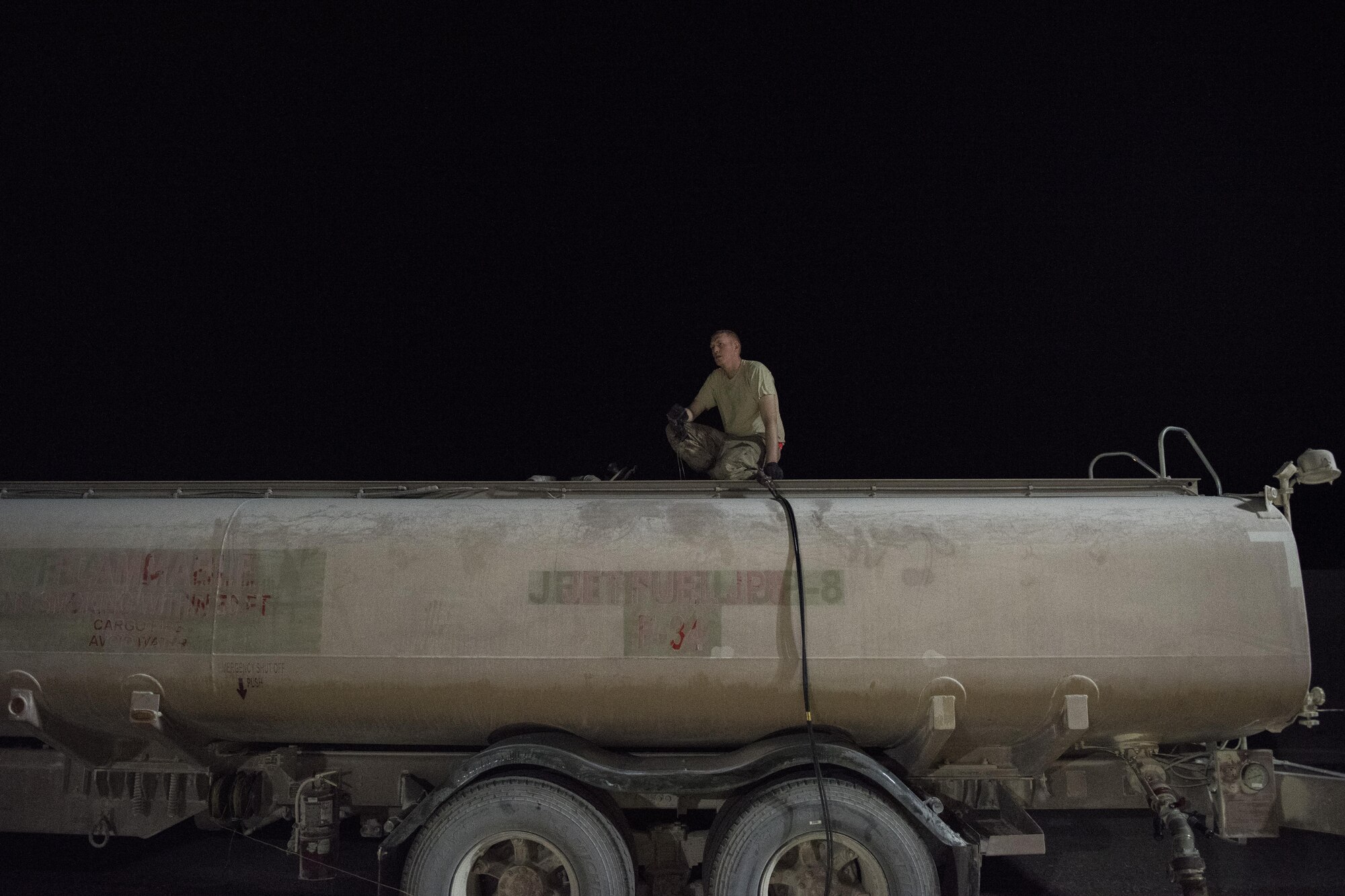 Staff Sgt. Kenneth Zaun, 332nd Expeditionary Logistics Readiness Squadron fuels flight controller, refills a fuel truck July 22, 2017 in Southwest Asia. The 332nd ELRS manages the fuel supply for aircraft, vehicles and generators throughout the installation. (U.S. Air Force photo/Senior Airman Damon Kasberg)