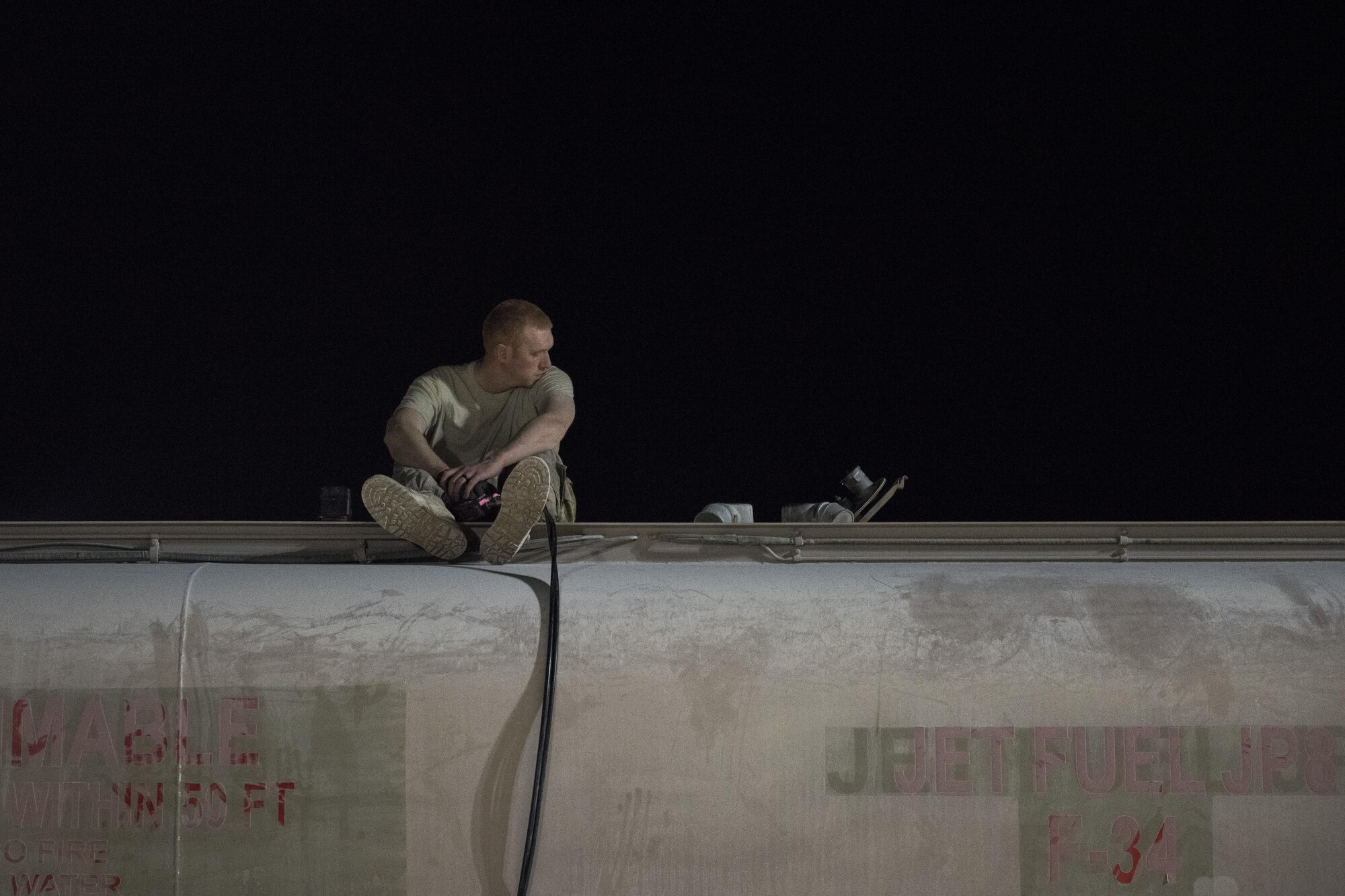 Staff Sgt. Kenneth Zaun, 332nd Expeditionary Logistics Readiness Squadron fuels flight controller, refills a fuel truck July 22, 2017 in Southwest Asia. Throughout the night members of the 332nd ELRS deliver thousands of gallons of fuel to aircraft, ensuring they are mission ready.
(U.S. Air Force photo/Senior Airman Damon Kasberg)