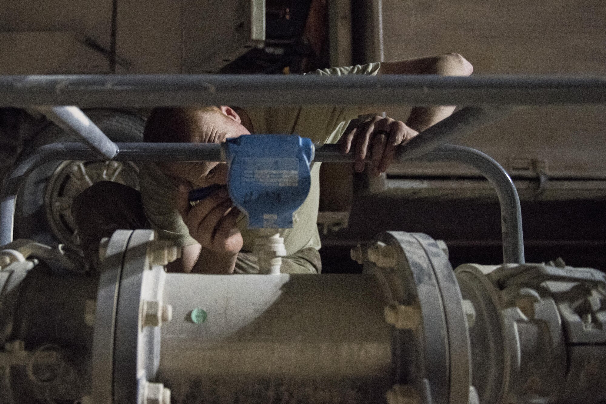 Staff Sgt. Kenneth Zaun, 332nd Expeditionary Logistics Readiness Squadron fuels flight controller, checks a fuel meter July 22, 2017 in Southwest Asia. The 332nd ELRS manages the fuel supply for aircraft, vehicles and generators throughout the installation. (U.S. Air Force photo/Senior Airman Damon Kasberg)