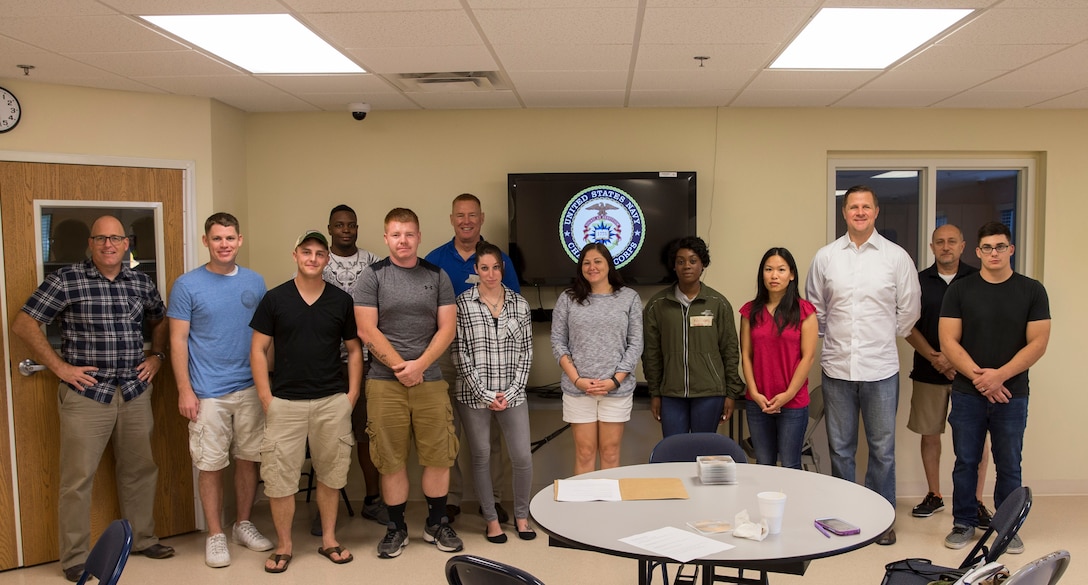 Marines and Sailors with 2nd Marine Logistics Group pose for a group photo during a Single Parent Retreat at Camp Lejeune, N.C., Sept. 23, 2017. The retreat was designed to offer single parent Marines and Sailors an opportunity to share experiences and gain insight about resources that could help them tackle challenges they face daily.
