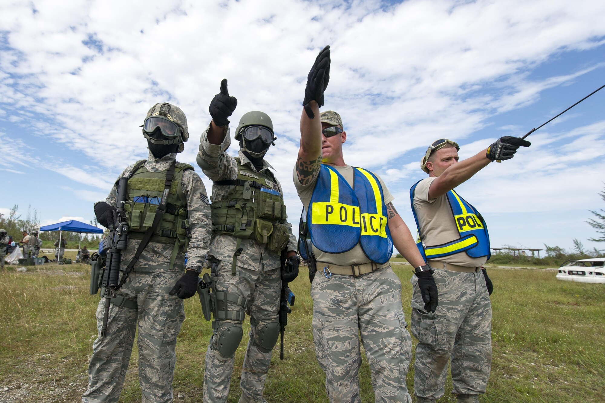 Reserve Citizen Airmen from the 482nd Security Force Squadron, Homestead Air Reserve Base, Florida, take cover and return fire while participating in a shoot, move, and communicate training with sim-munitions on September 26, 2017.  This annual training for security forces members helps keep the airmen proficient in many situation they may encounter stateside or overseas. (U.S. Air Force photo by Staff Sgt. Kyle Brasier)