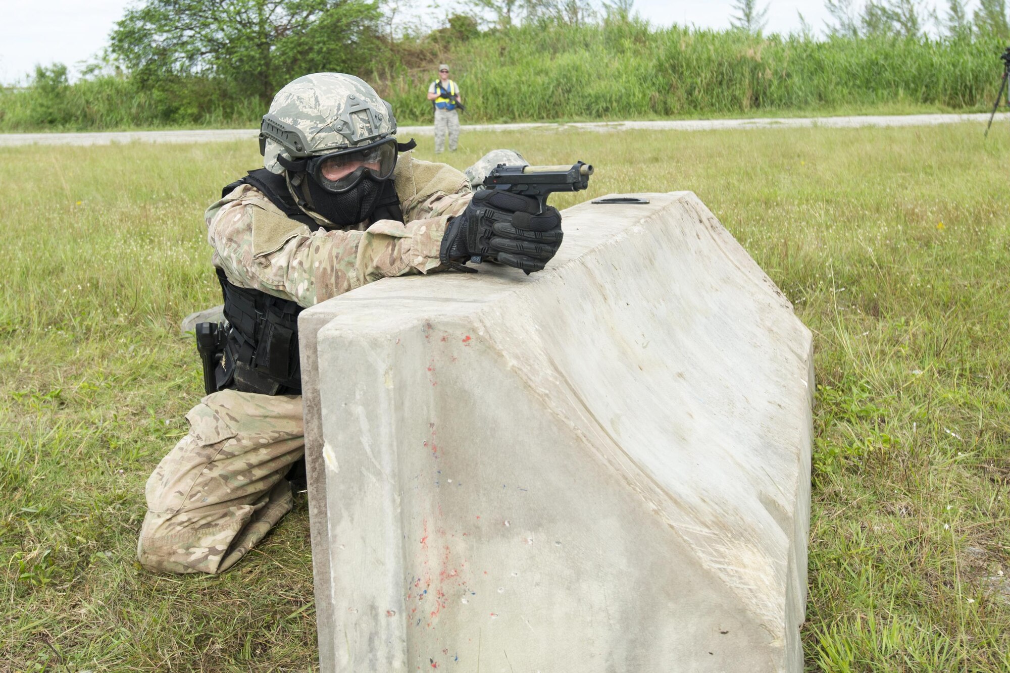 Reserve Citizen Airmen from the 482nd Security Force Squadron, Homestead Air Reserve Base, Florida, take cover and return fire while participating in a shoot, move, and communicate training with sim-munitions on September 26, 2017.  This annual training for security forces members helps keep the airmen proficient in many situation they may encounter stateside or overseas. (U.S. Air Force photo by Staff Sgt. Kyle Brasier)